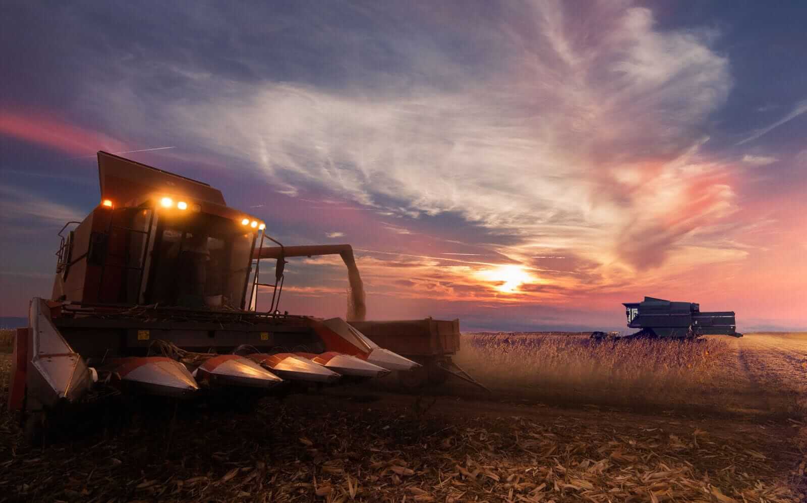 Combine harvesting field crops by fotokostic via iStock