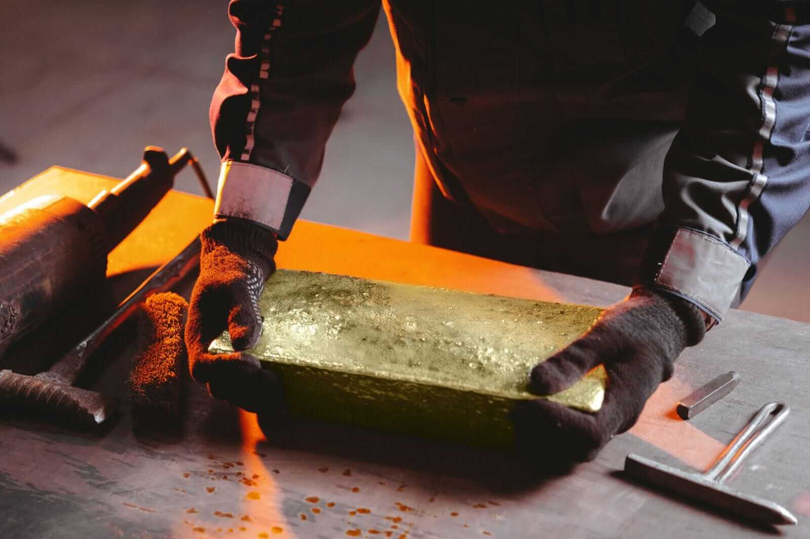 Creating gold bullion by Mark Agnor via Shutterstock