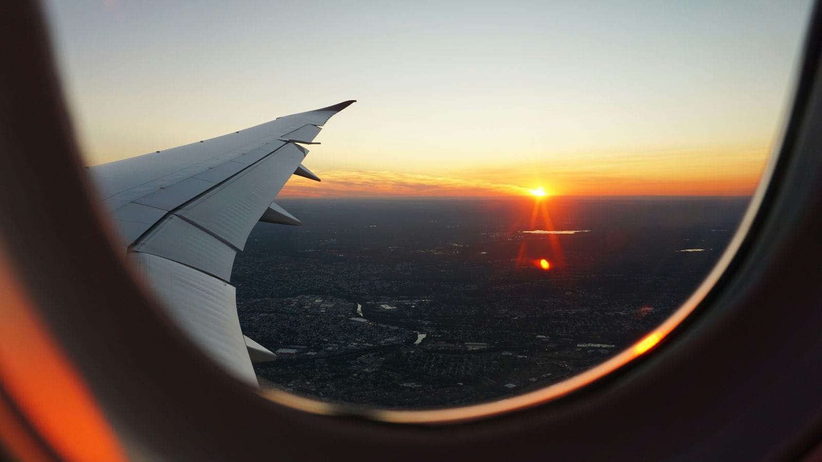 Window view from airplane during golden hour by Eva Darron via Unsplash